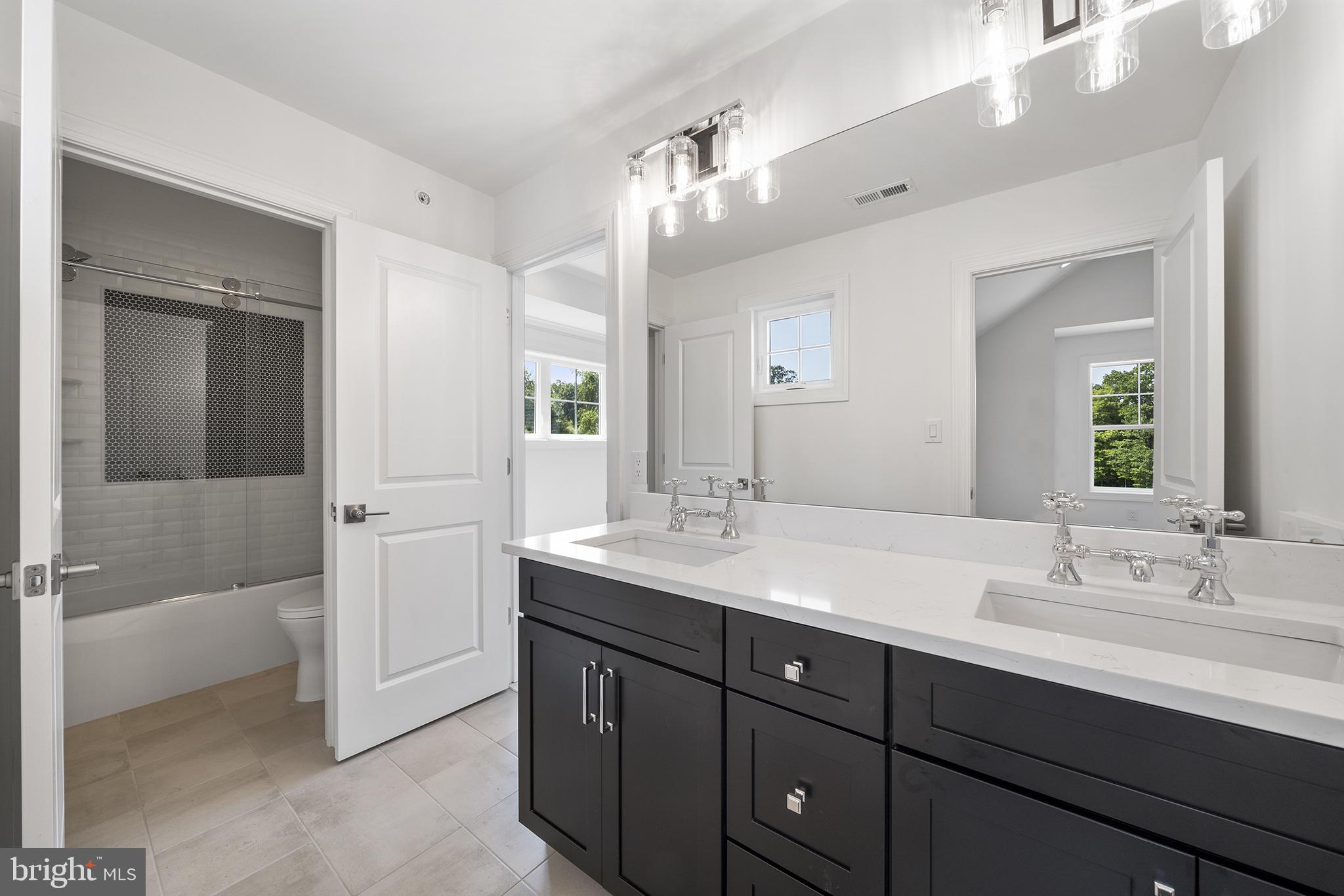 5 Big Oak Road Yardley, PA 19067 - Photo 17 of 27 a bathroom with a sink double vanity granite tub shower and a mirror