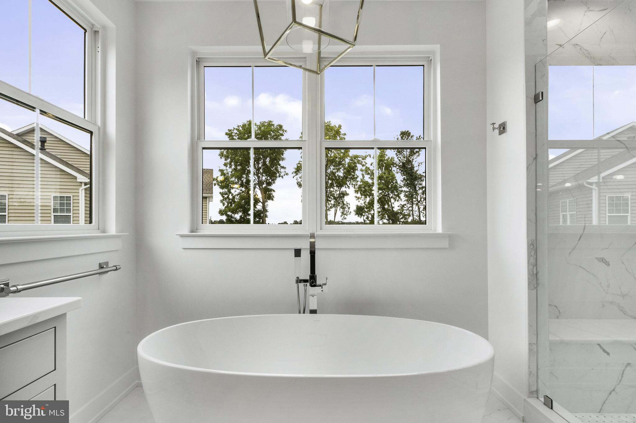 5 Big Oak Road Yardley, PA 19067 - Photo 20 of 27 a white bath tub sitting next to a window