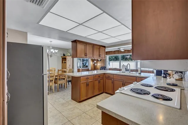 a kitchen with stainless steel appliances granite countertop a sink and cabinets