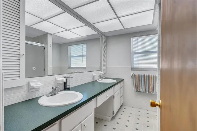 a bathroom with a sink a mirror and a bathtub