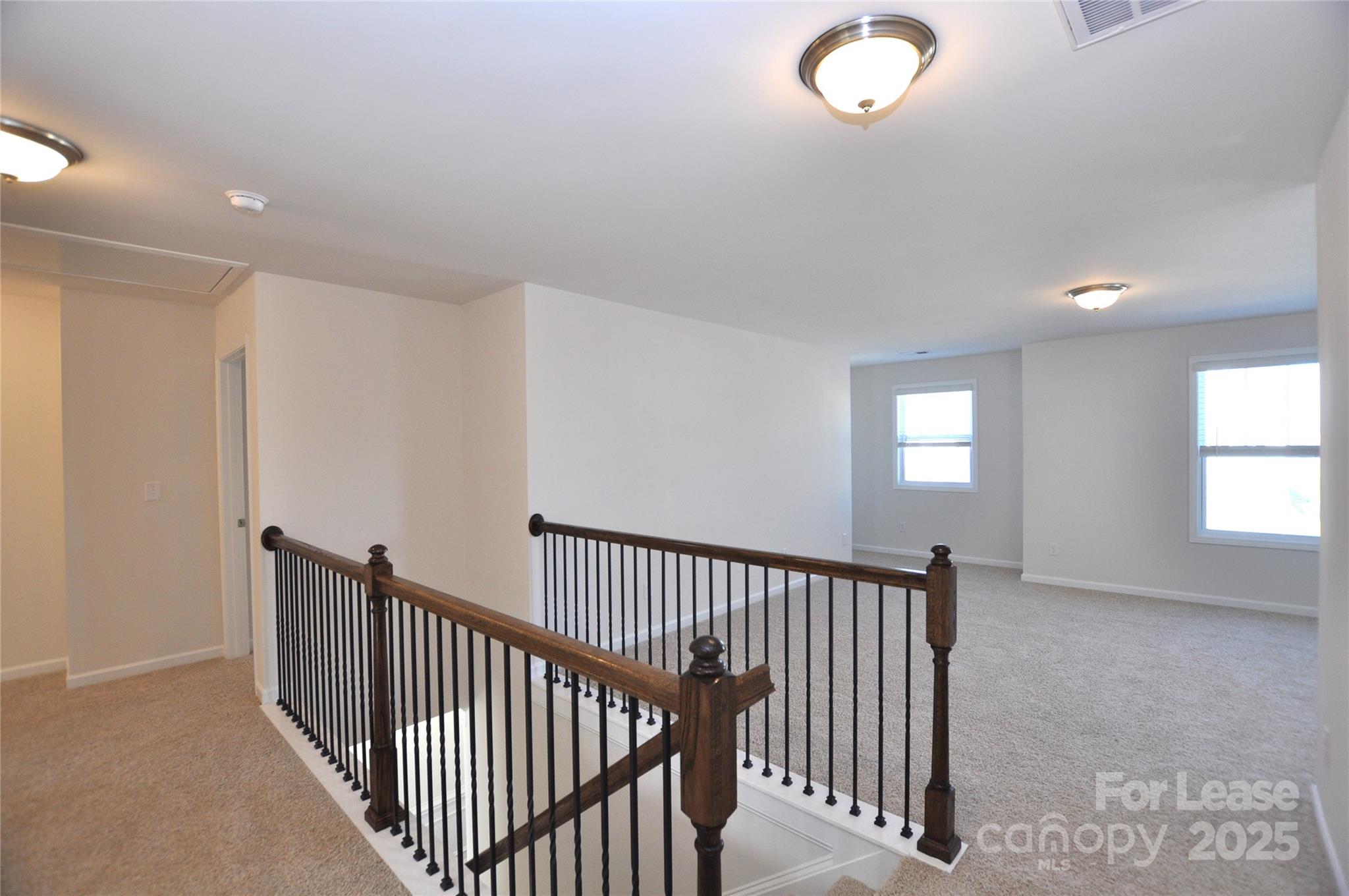 8007 Oakmere Road Waxhaw, NC 28173 - Photo 13 of 28 a view of a hallway with windows