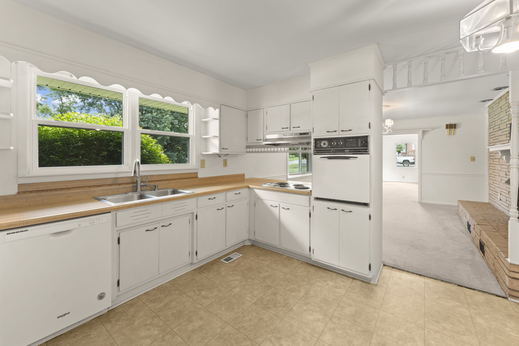 307 Mary Sharp Drive Decherd, TN 37324 - Photo 11 of 27 a kitchen with white cabinets and white appliances