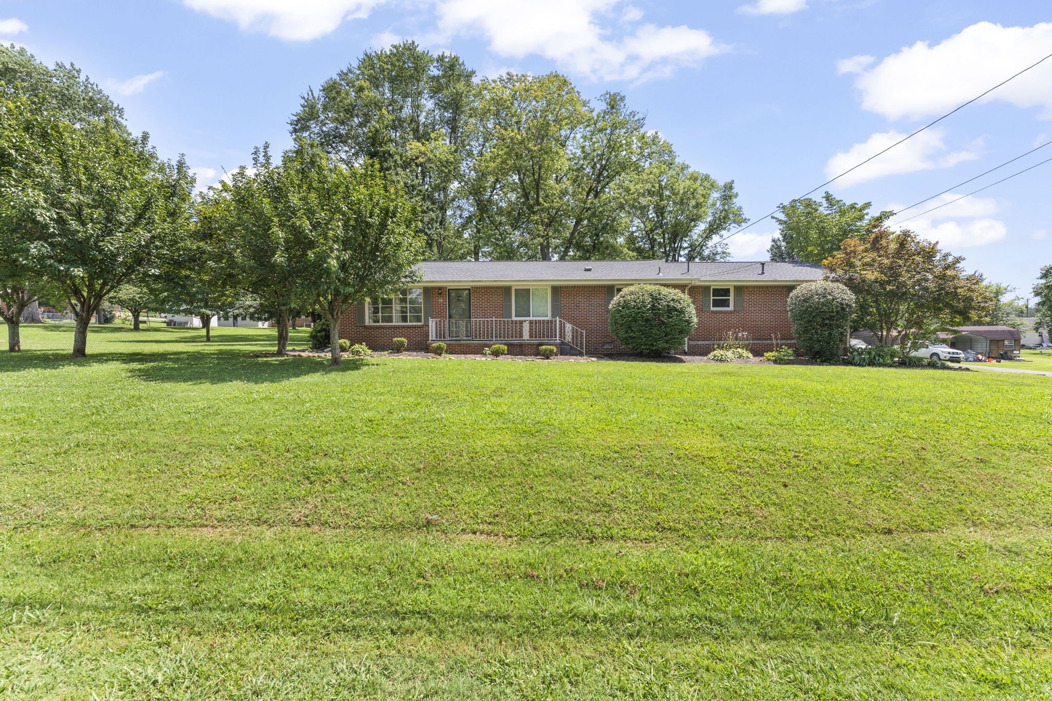 307 Mary Sharp Drive Decherd, TN 37324 - Photo 2 of 27 a view of a house with a yard and a porch