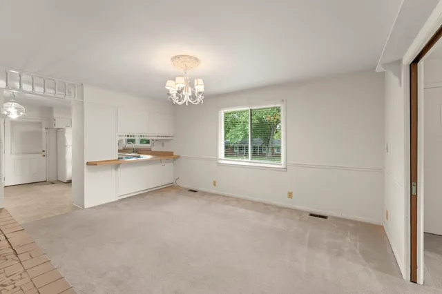 a view of a kitchen with furniture and a kitchen