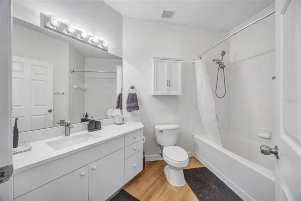 a view of a livingroom with wooden floor