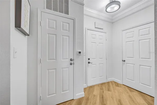 a kitchen with white cabinets