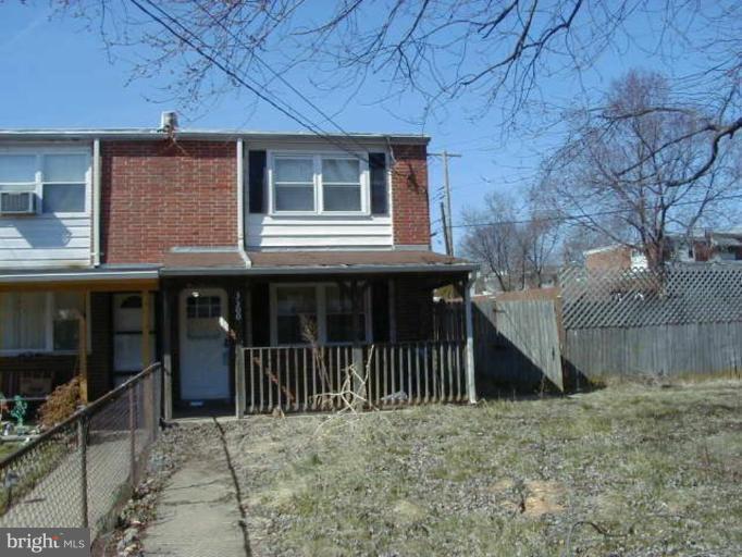 3300 Bero Road Halethorpe, MD 21227 - Photo 1 of 1 a view of a house with a small yard and wooden fence