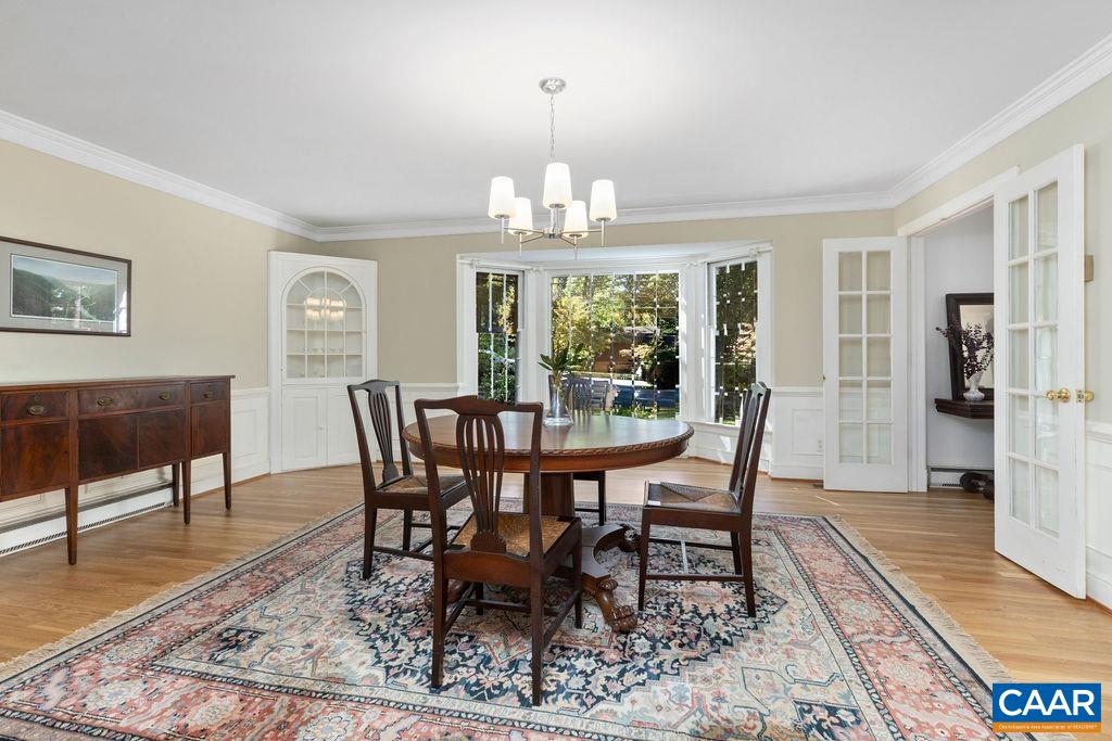 1730 Old Forge Road Charlottesville, VA 22901 - Photo 14 of 48 a view of a dining room with furniture window and wooden floor