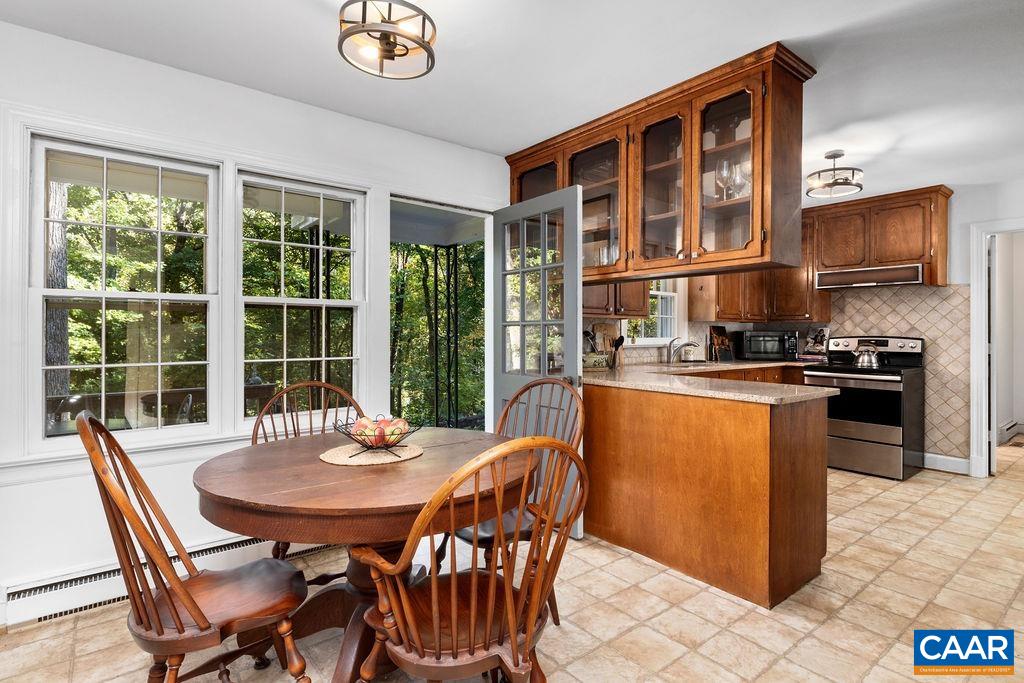 1730 Old Forge Road Charlottesville, VA 22901 - Photo 18 of 48 a dining room with furniture and a floor to ceiling window