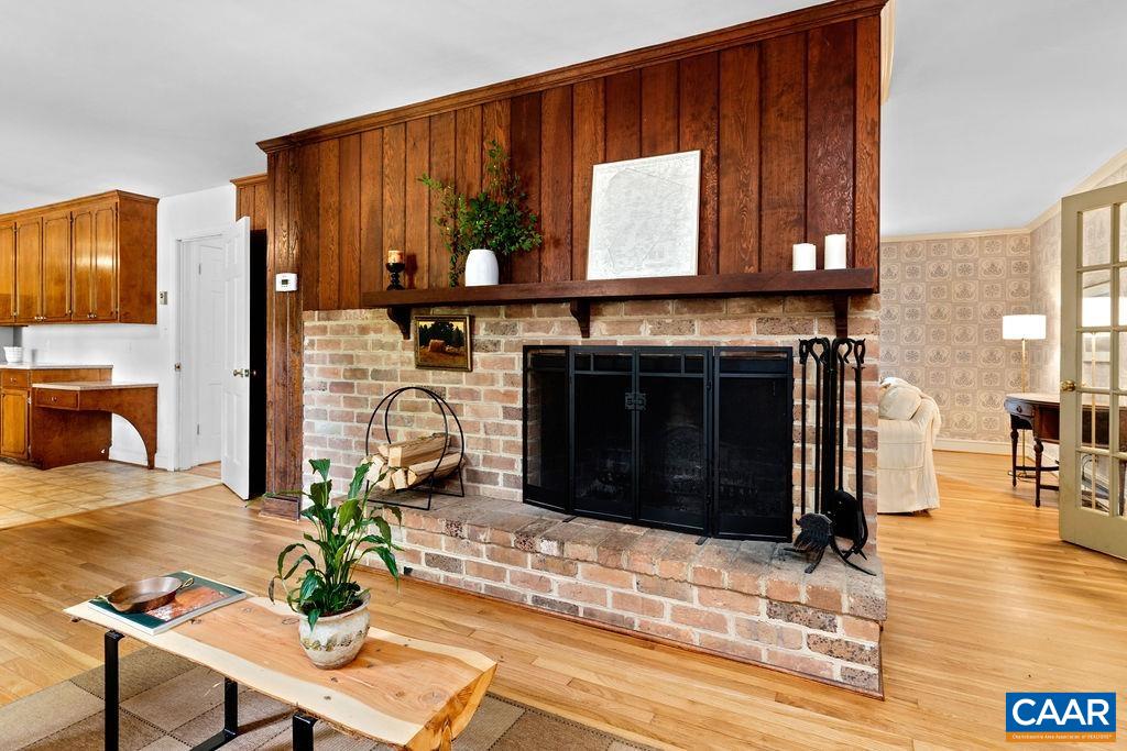 1730 Old Forge Road Charlottesville, VA 22901 - Photo 23 of 48 a living room with furniture a fireplace and a table