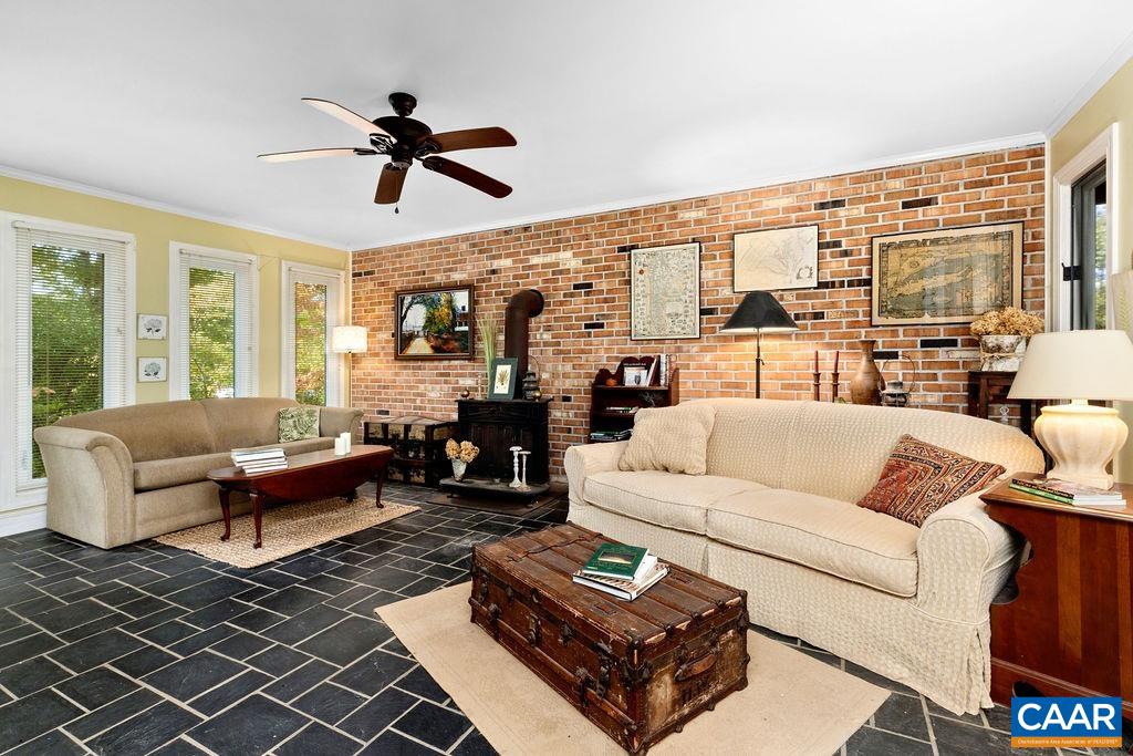 1730 Old Forge Road Charlottesville, VA 22901 - Photo 27 of 48 a living room with furniture large window and a table
