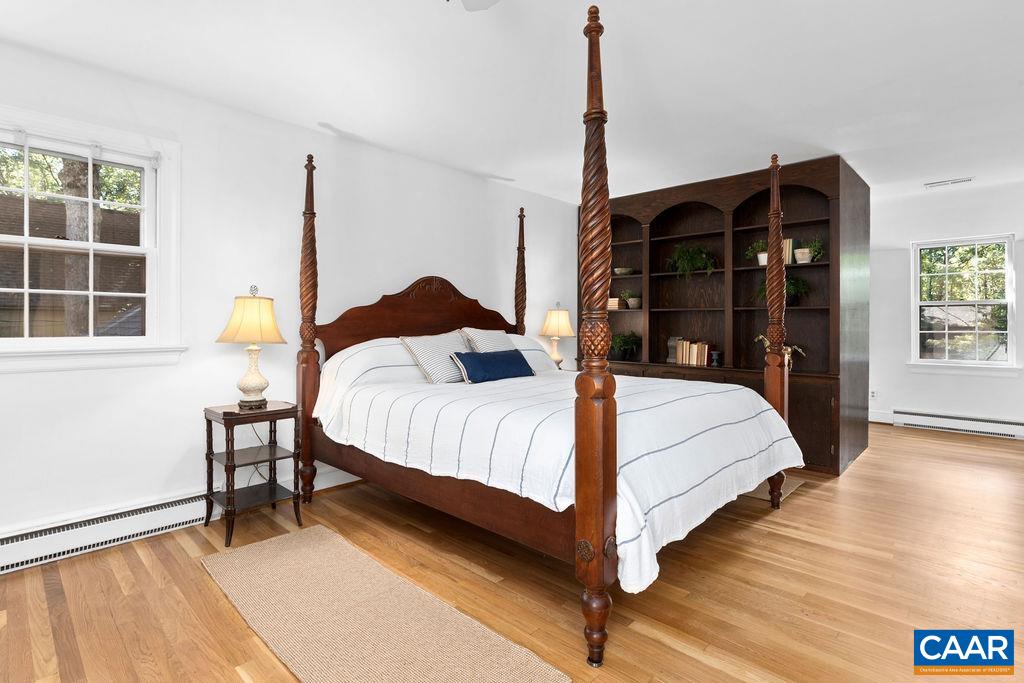 1730 Old Forge Road Charlottesville, VA 22901 - Photo 31 of 48 a bedroom with a bed window and lamp