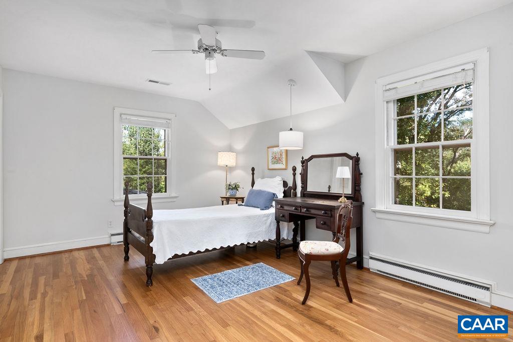 1730 Old Forge Road Charlottesville, VA 22901 - Photo 38 of 48 a bedroom with a bed windows table and chair