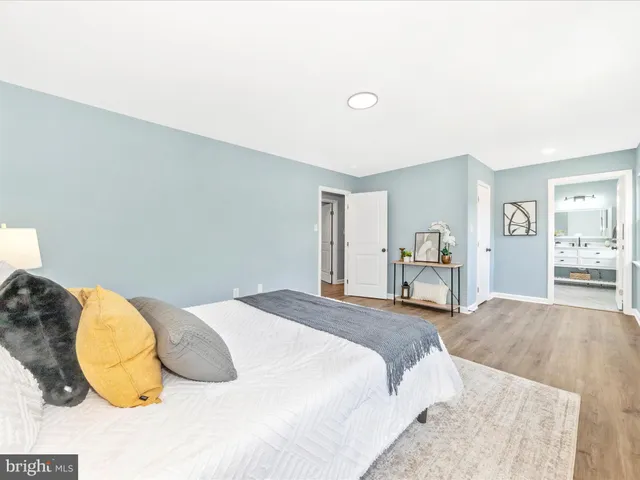 a bedroom with a bed and dresser