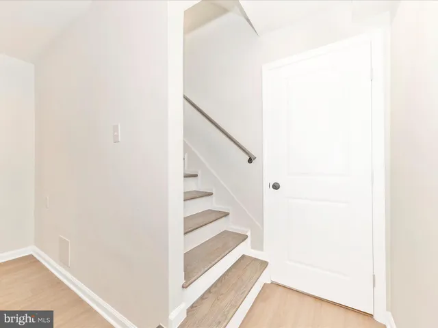 a view of a hallway with staircase