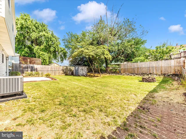 a view of a swimming pool with an outdoor space and seating area