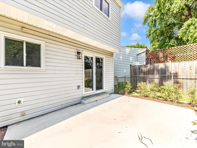 a view of a white house with a large windows