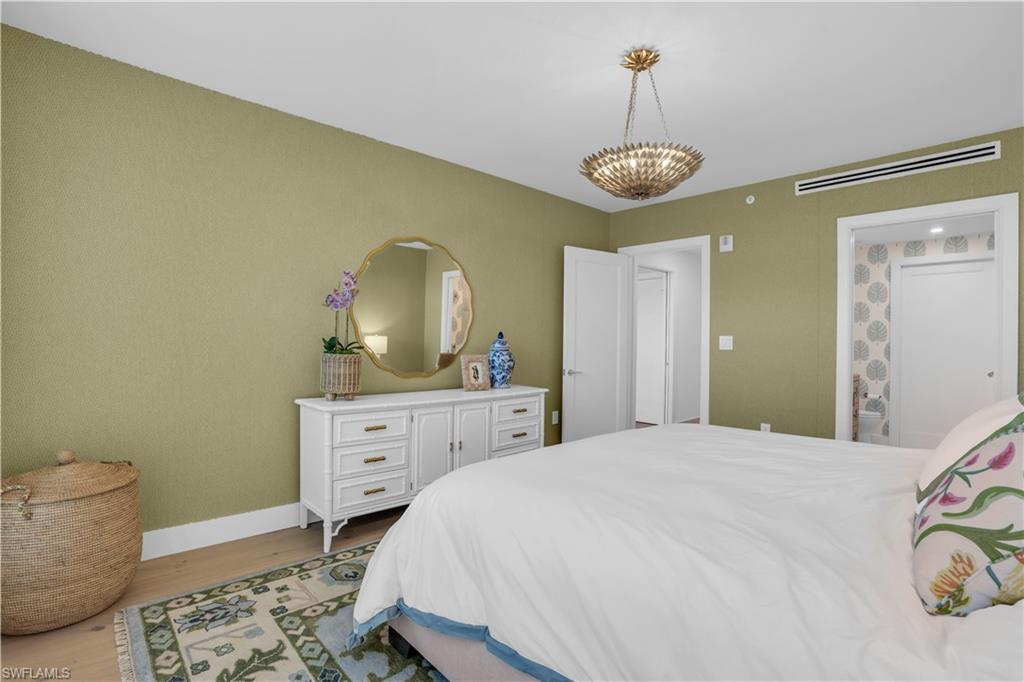 13945 Old Coast Road, Unit 301 Naples, FL 34110 - Photo 16 of 30 a bedroom with a bed and a window