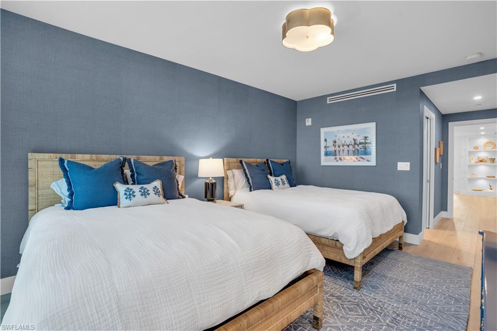 13945 Old Coast Road, Unit 301 Naples, FL 34110 - Photo 20 of 30 a bedroom with bed and window