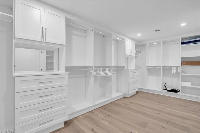 a view of cabinets and wooden floor