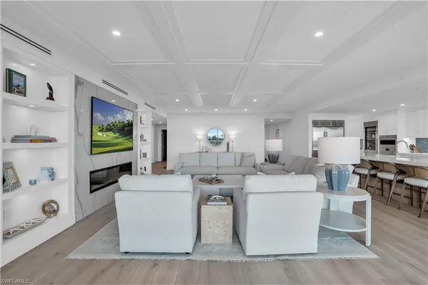 a living room with fireplace furniture and a flat screen tv