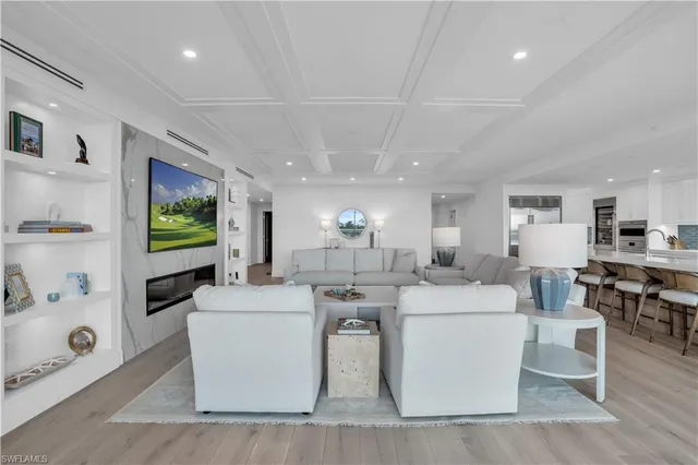 a living room with fireplace furniture and a flat screen tv