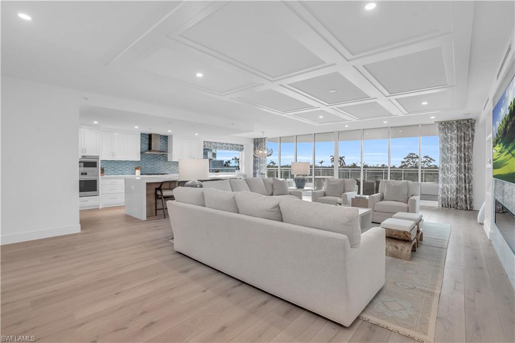 13945 Old Coast Road, Unit 301 Naples, FL 34110 - Photo 7 of 30 a living room with furniture and a view of kitchen