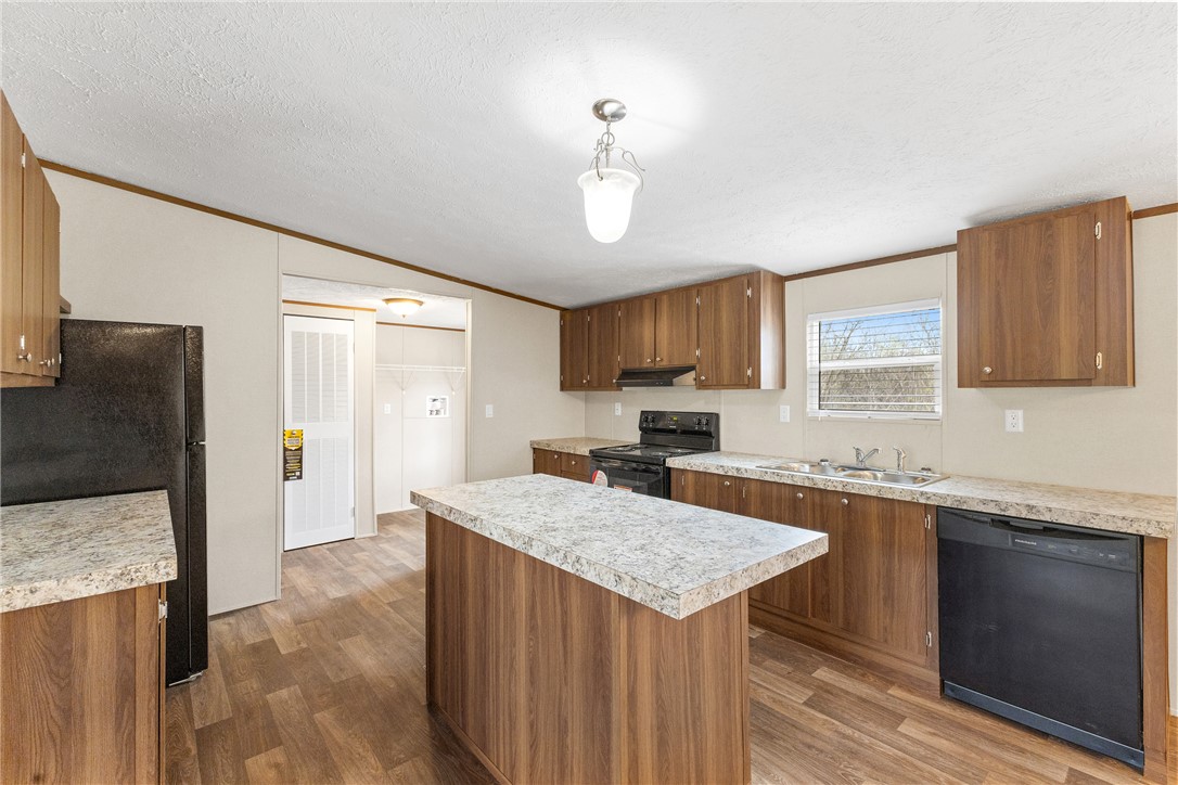 1014 Doe Run Road Caldwell, TX 77836 - Photo 11 of 23 a kitchen with a sink a counter top space and stainless steel appliances