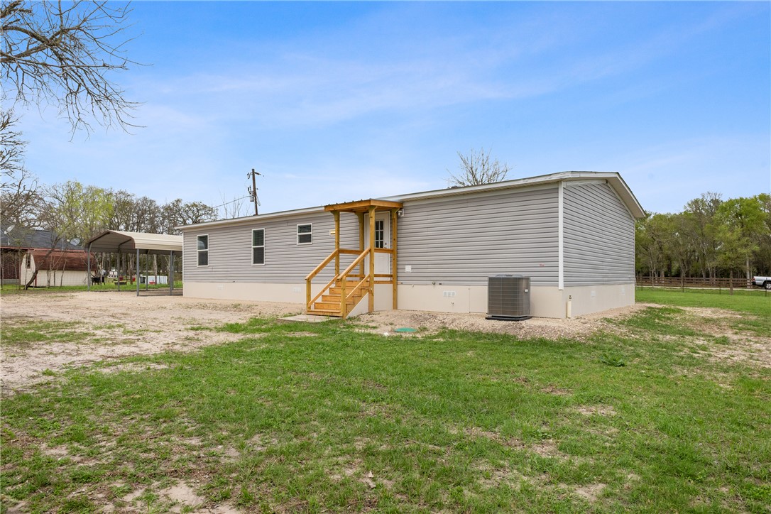 1014 Doe Run Road Caldwell, TX 77836 - Photo 22 of 23 a view of a house with a yard