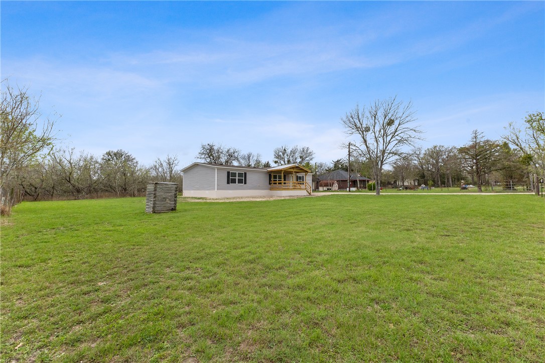 1014 Doe Run Road Caldwell, TX 77836 - Photo 5 of 23 a front view of a house with garden