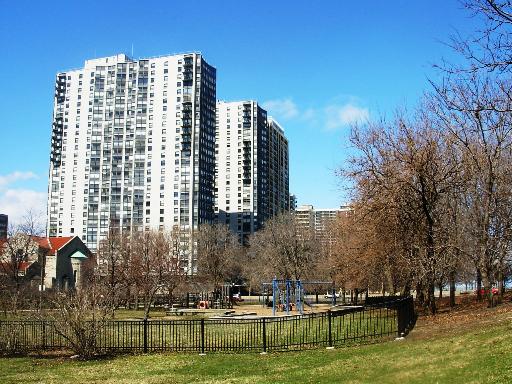 5701 North Sheridan Road, Unit 30P Chicago, IL 60660 - Photo 1 of 1 a view of a large building with a yard