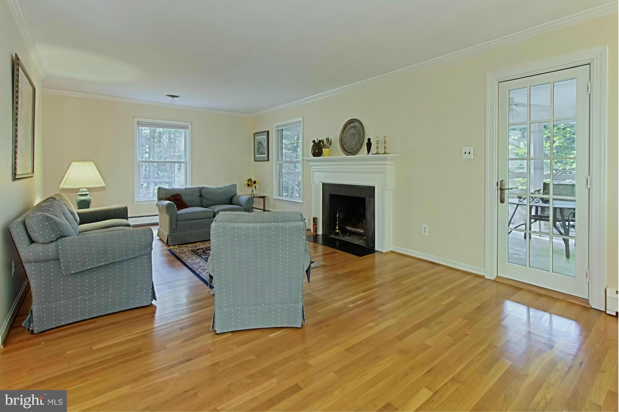 12207 Hounds Lane Reston, VA 20191 - Photo 13 of 30 Family Room with Fireplace Opens to Screen Porch