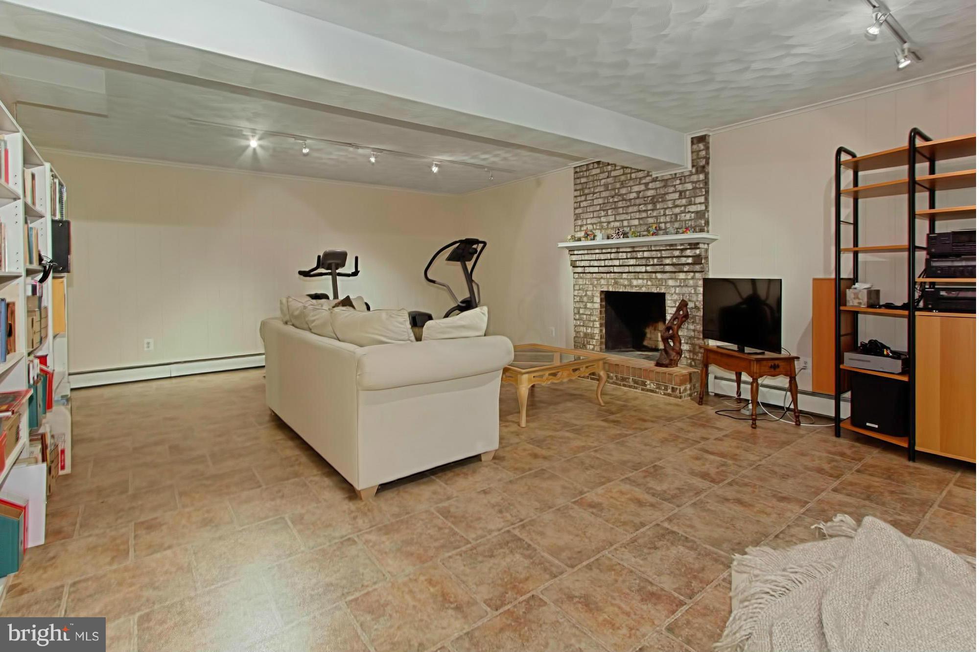 12207 Hounds Lane Reston, VA 20191 - Photo 23 of 30 Spacious Lower Level with Wood-Burning Fireplace