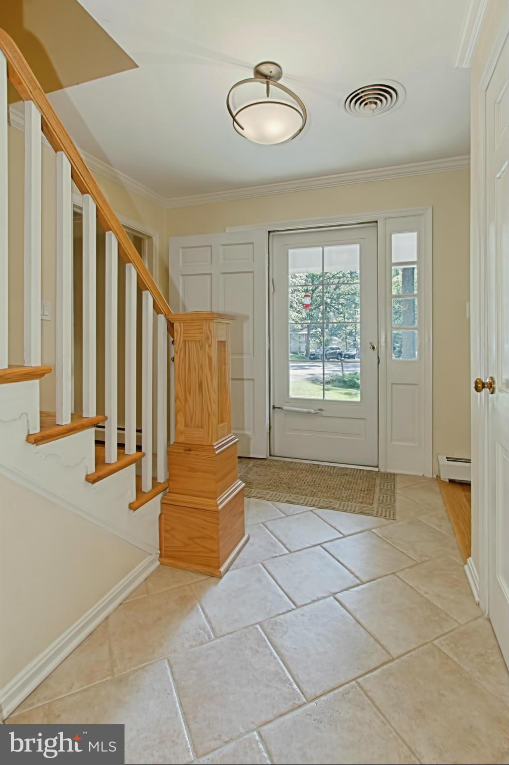 12207 Hounds Lane Reston, VA 20191 - Photo 29 of 30 Foyer with Modern Chandelier