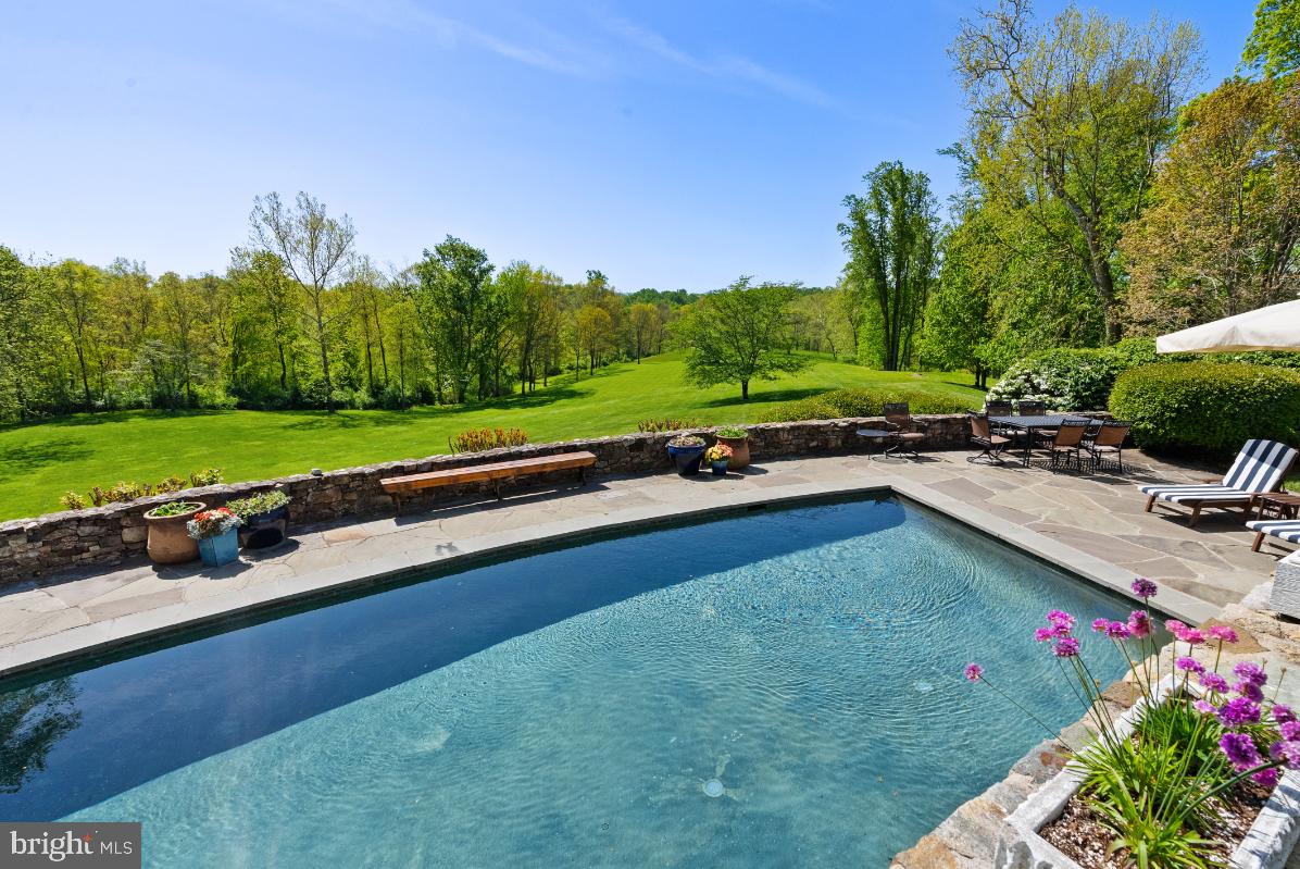 36987 Mountville Road Middleburg, VA 20117 - Photo 13 of 18 a view of a backyard with a garden and outdoor seating