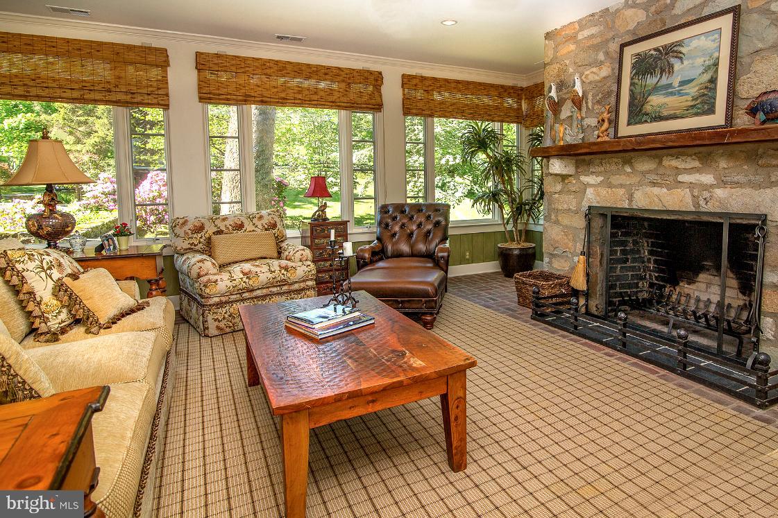 36987 Mountville Road Middleburg, VA 20117 - Photo 7 of 18 a living room with furniture a large window and a fireplace