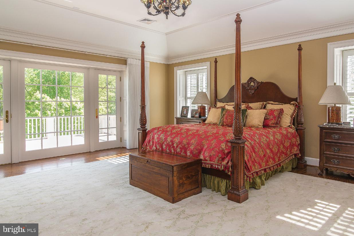 36987 Mountville Road Middleburg, VA 20117 - Photo 9 of 18 a spacious bedroom with a bed lamps and window