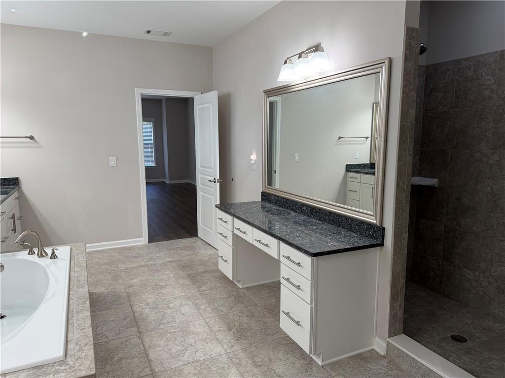 5670 Bridleton Crossing Suwanee, GA 30024 - Photo 16 of 23 a kitchen with a sink and a mirror