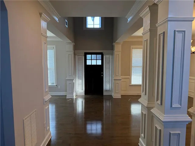 a view of gallery with wooden floor