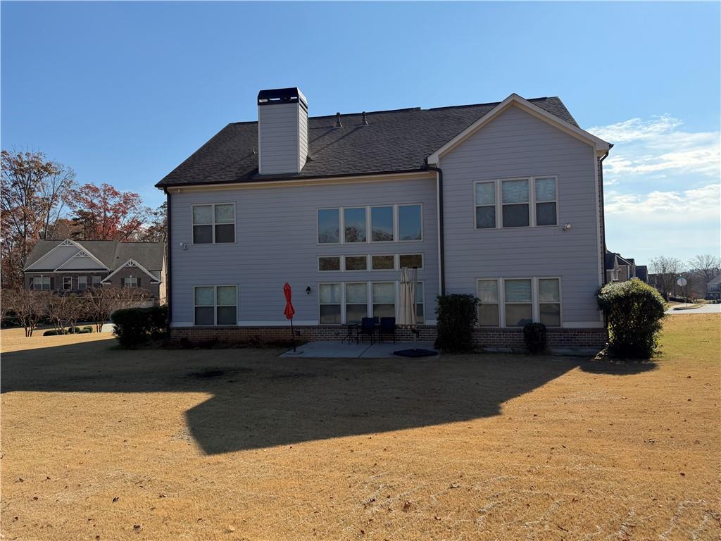 5670 Bridleton Crossing Suwanee, GA 30024 - Photo 23 of 23 a front view of a house with a yard