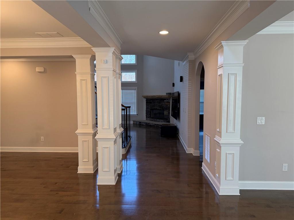 5670 Bridleton Crossing Suwanee, GA 30024 - Photo 3 of 23 a view of entryway with livingroom and wooden floor