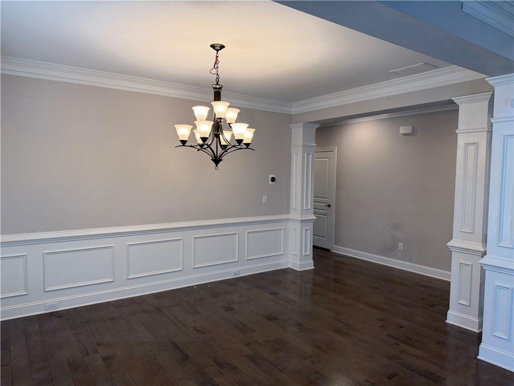 5670 Bridleton Crossing Suwanee, GA 30024 - Photo 5 of 23 a view of an empty room with wooden floor