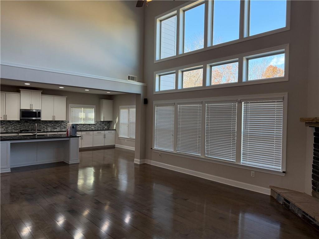 5670 Bridleton Crossing Suwanee, GA 30024 - Photo 6 of 23 a kitchen with a refrigerator and a stove top oven