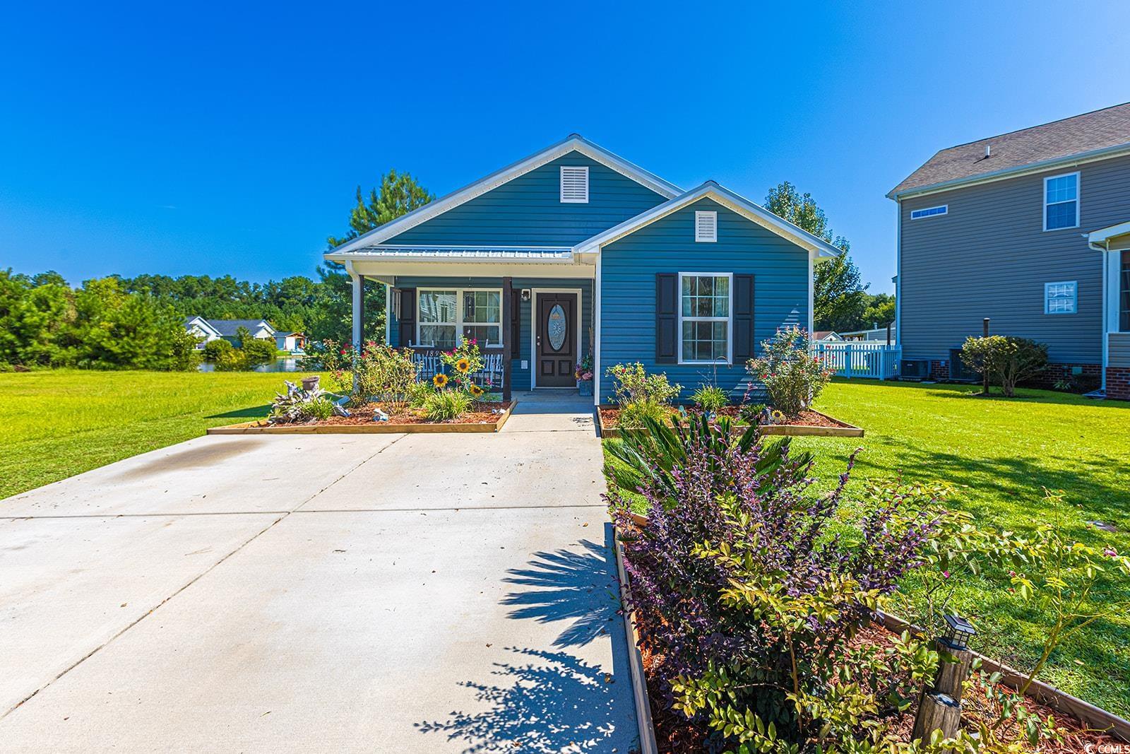 Bungalow-style home featuring a front yard and a p