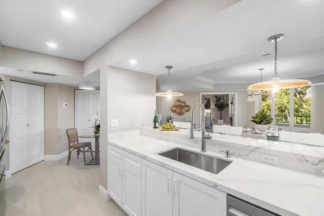 a bathroom with a bathtub shower sink vanity and toilet