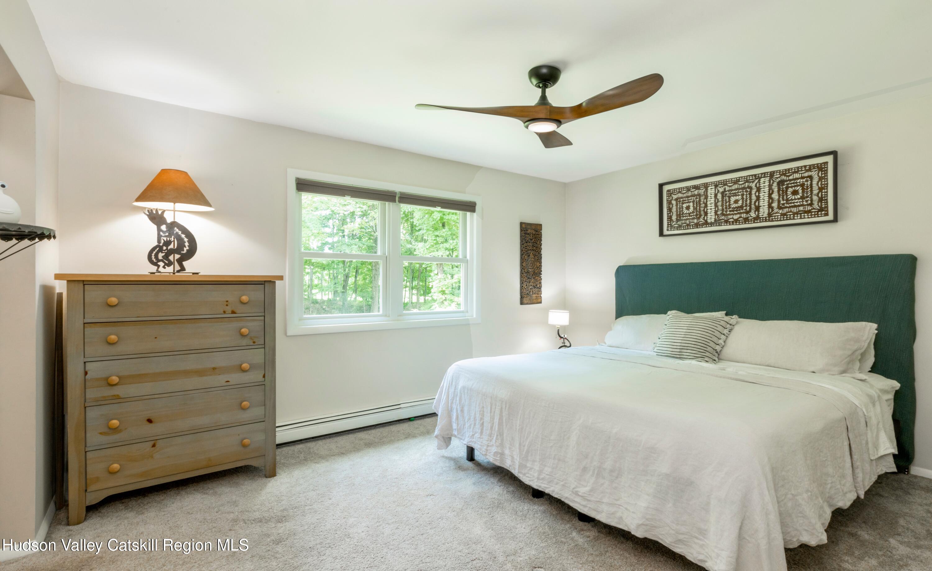 424 Tongore Way Kingston, NY 12401 - Photo 15 of 40 a bedroom with a bed and a dresser