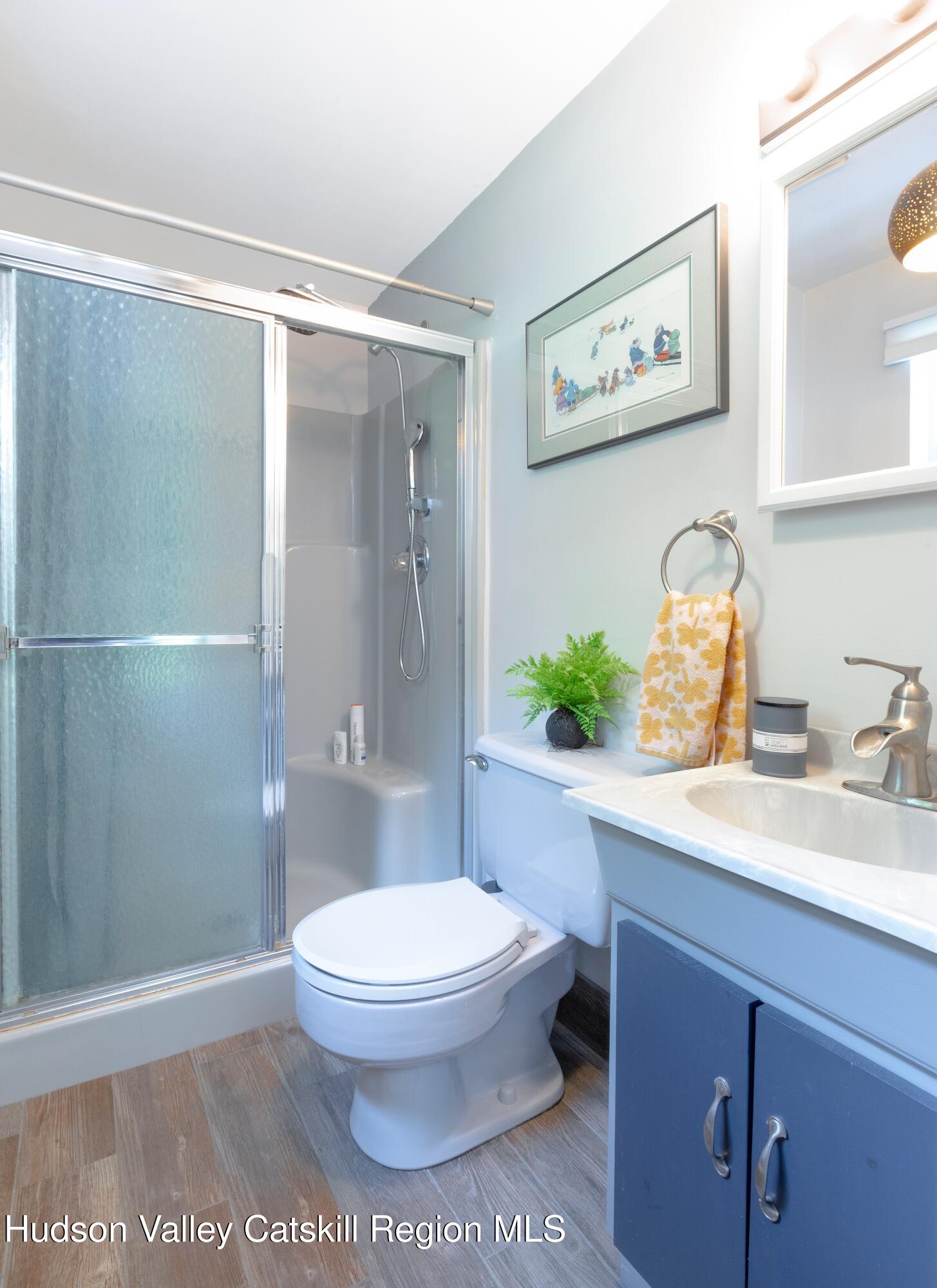 424 Tongore Way Kingston, NY 12401 - Photo 21 of 40 a bathroom with a toilet sink and shower