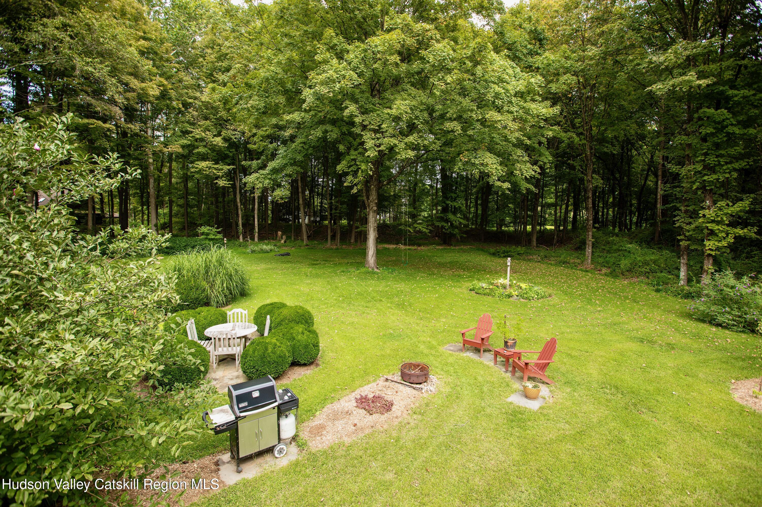 424 Tongore Way Kingston, NY 12401 - Photo 24 of 40 a garden view with a sitting space