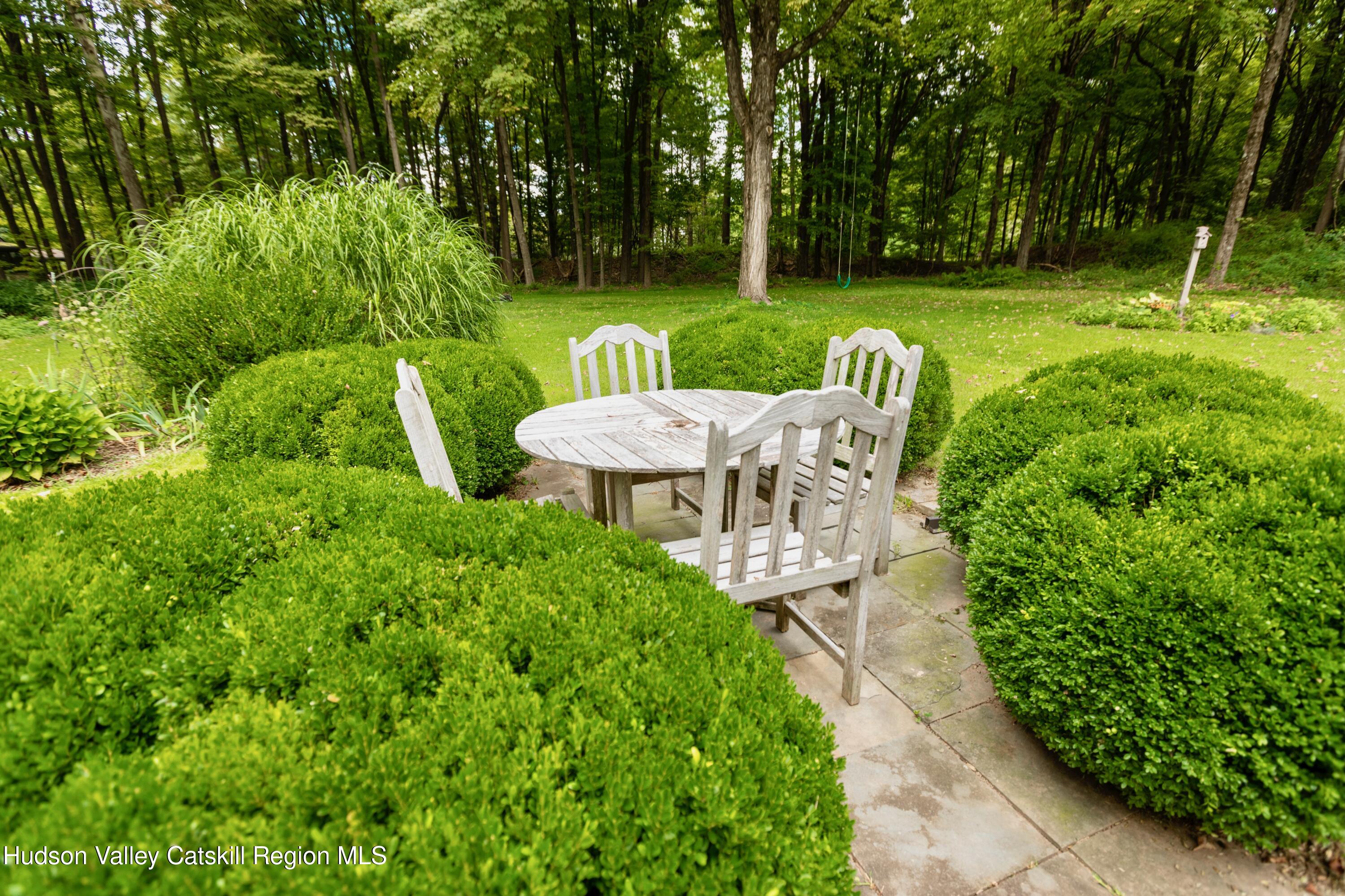 424 Tongore Way Kingston, NY 12401 - Photo 28 of 40 a view of a table and chairs in the garden