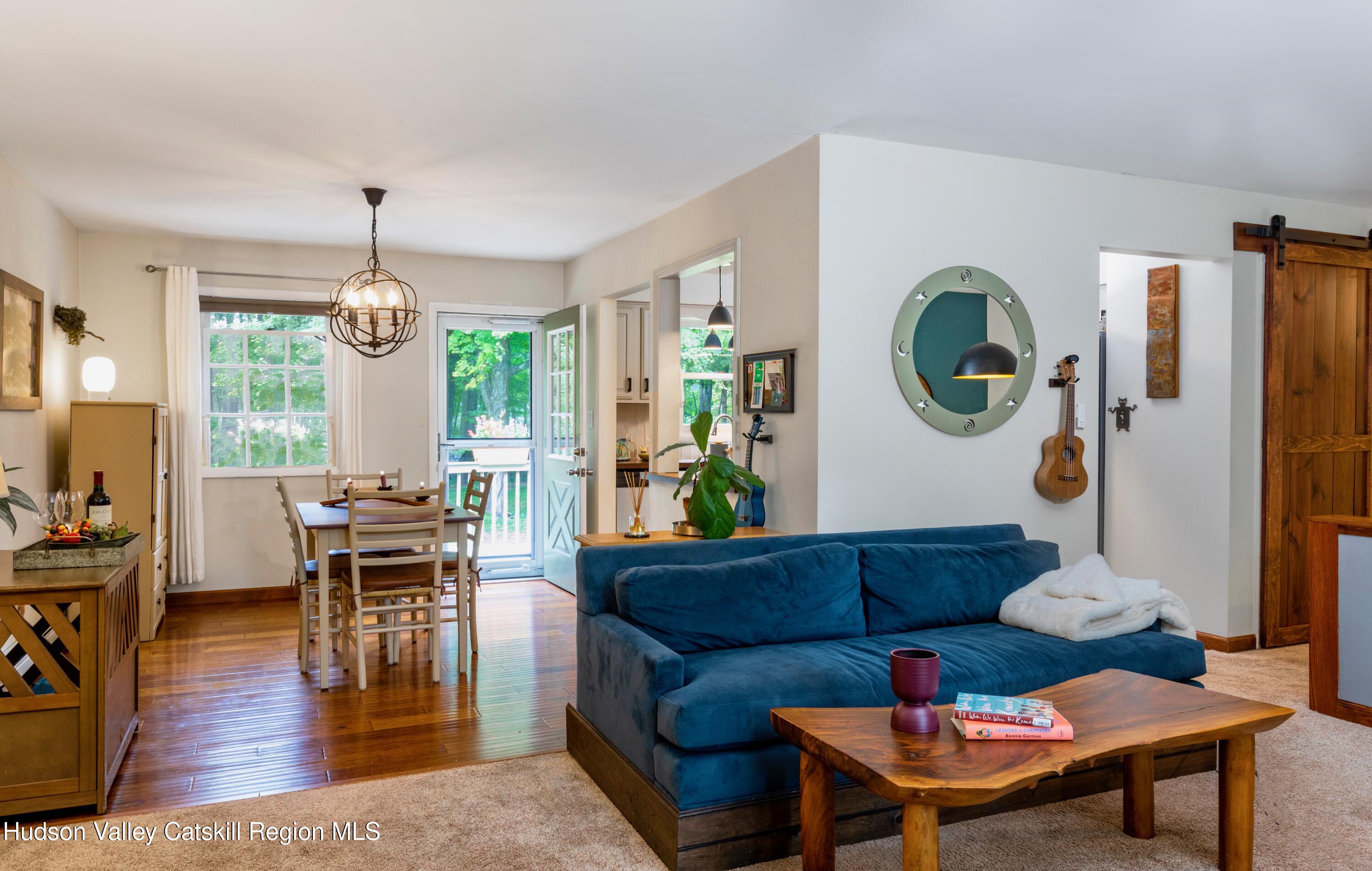 424 Tongore Way Kingston, NY 12401 - Photo 3 of 40 a living room with furniture and wooden floor
